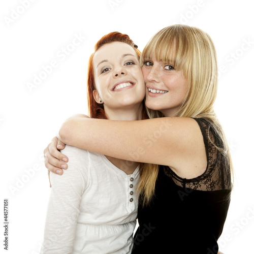 Photo: young beautiful red and blond haired girls hugs young beautiful red and blond haired girls hugs