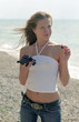 woman with grapes on a beach