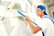 painter at home renovation work with prime