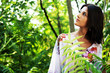 Beautiful woman walking in tropical forest