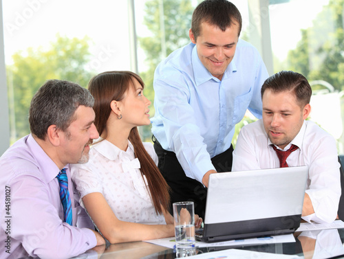 Photo: business team in business meeting business team in business meeting