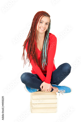 Photo: beautiful student girl with african braids with stack of books beautiful student girl with african braids with stack of books
