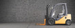 Forklift standing on industrial dirty concrete wall background