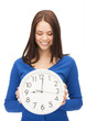 Photo: woman holding big clock woman holding big clock