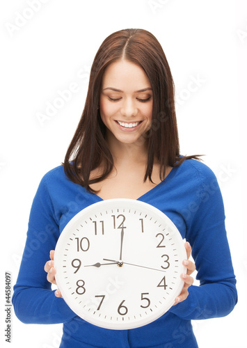 Photo: woman holding big clock woman holding big clock
