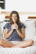 Cute young lady with a cup of coffee
