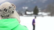 Teenage Boy And Friend Having Snowball Fight