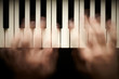 Hands playing piano. Motion blur