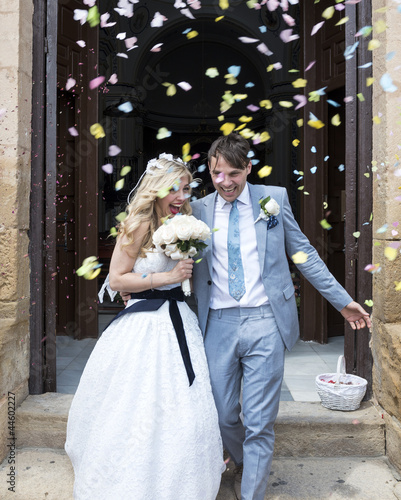 Photo: Confetti being thrown over the Bride and Groom Confetti being thrown over the Bride and Groom