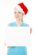 Fitness santa woman holds blank sign