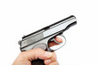 Gun in hand on a white background.