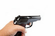 Gun in hand on a white background.