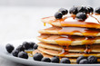 Breakfast blueberry pancakes with maple syrup