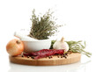 dried herbs in mortar and vegetables, isolatrd on white