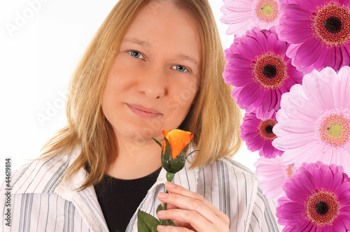 Photo: Woman with a rose and gerbera background Woman with a rose and gerbera background