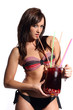 Photo: sexy woman in bikini holding a cocktail with tropical fruits in sexy woman in bikini holding a cocktail with tropical fruits in