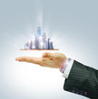 Foto: Business city center in businessman's hand Business city center in businessman's hand