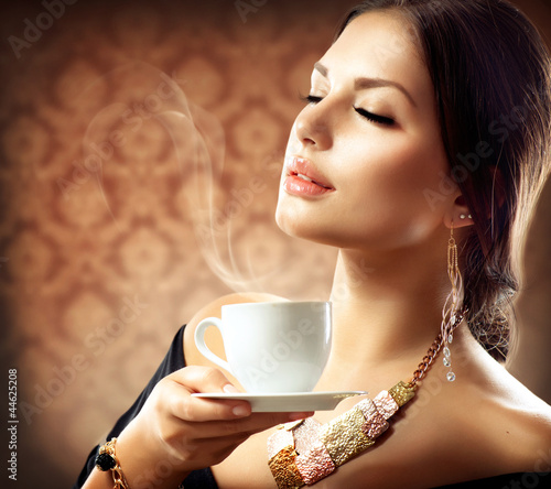 Photo: Beautiful Woman With Cup of Coffee or Tea Beautiful Woman With Cup of Coffee or Tea