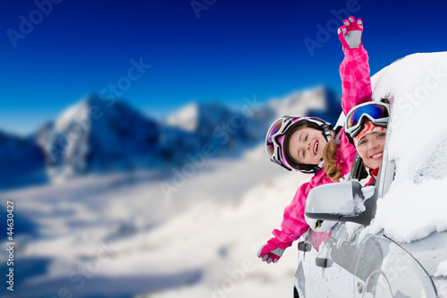 Photo: Winter holiday - happy family on the road for winter holidays Winter holiday - happy family on the road for winter holidays