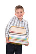 Foto: The schoolchild with a huge pile of heavy books in hands. The schoolchild with a huge pile of heavy books in hands.