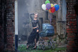 Foto: Young sexy woman with balloons and baby carriage Young sexy woman with balloons and baby carriage