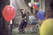 Young sexy woman with balloons and baby carriage