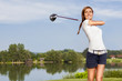 Photo: Golf player teeing off Golf player teeing off