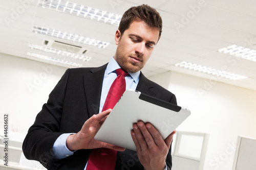 Photo: Businessman using a tablet Businessman using a tablet