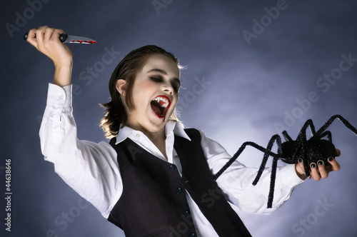 Photo: Mad vampire boy prepared to stab a spider Mad vampire boy prepared to stab a spider