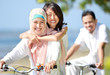 Photo: happy family riding bikes happy family riding bikes