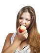 Young beautiful woman with an apple looking towards camera