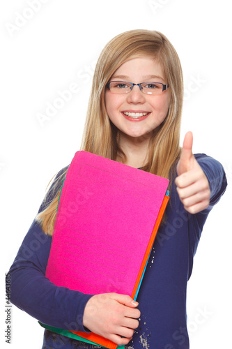 Photo: educational concept schoolgirl giving thumbs up educational concept schoolgirl giving thumbs up