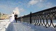 Two newly-married couple goes on quay