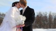 Newly-married couple kisses, and on hands at them pigeons sit