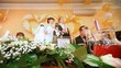 Newly-married couple stands up for festive table
