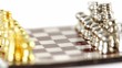 Small metalic chess figures in start position spin