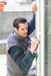 Man fitting new window