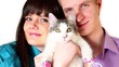Young boy and girl hold cat in pink shoes