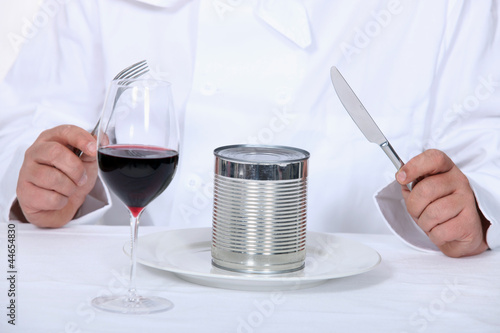 Photo: Chef sitting down to a canned dinner Chef sitting down to a canned dinner