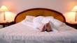 Woman lay in bed and moves bootless feet
