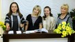 Four employees of beauty salon kindly look and smile
