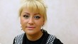 woman which works in beauty salon looks in videocamera