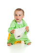 Child on potty play with toilet paper