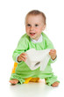 Child on potty play with toilet paper