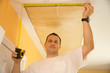 Handyman with tape measure