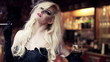 Video: Gorgeous femme fatale with cigarette in bar, steadicam shot Gorgeous femme fatale with cigarette in bar, steadicam shot