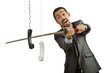 Angry businessman cutting the phone cable