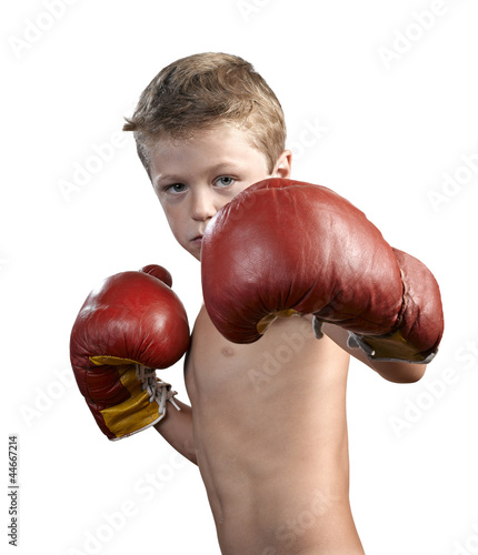 Photo: cute little boy with boxing gloves isolated on white cute little boy with boxing gloves isolated on white