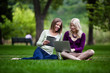 Young Women in Park with Tech
