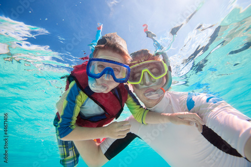 Photo: Father and son snorkeling Father and son snorkeling